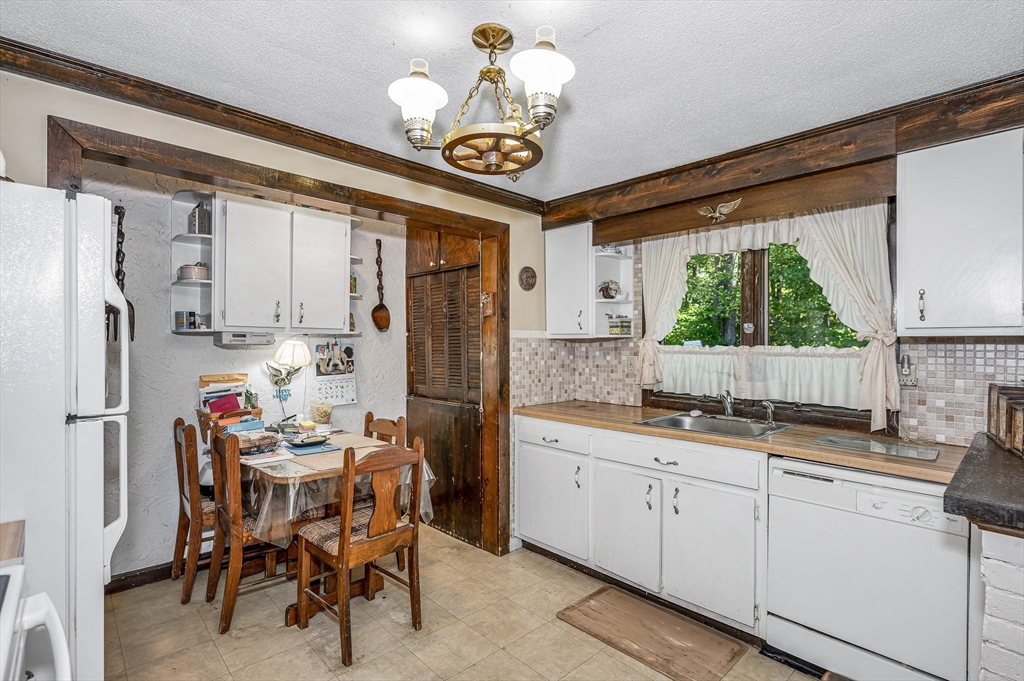 19 Reo Road Maynard, MA 01754 - Photo 21 of 41 a kitchen with a refrigerator and a sink