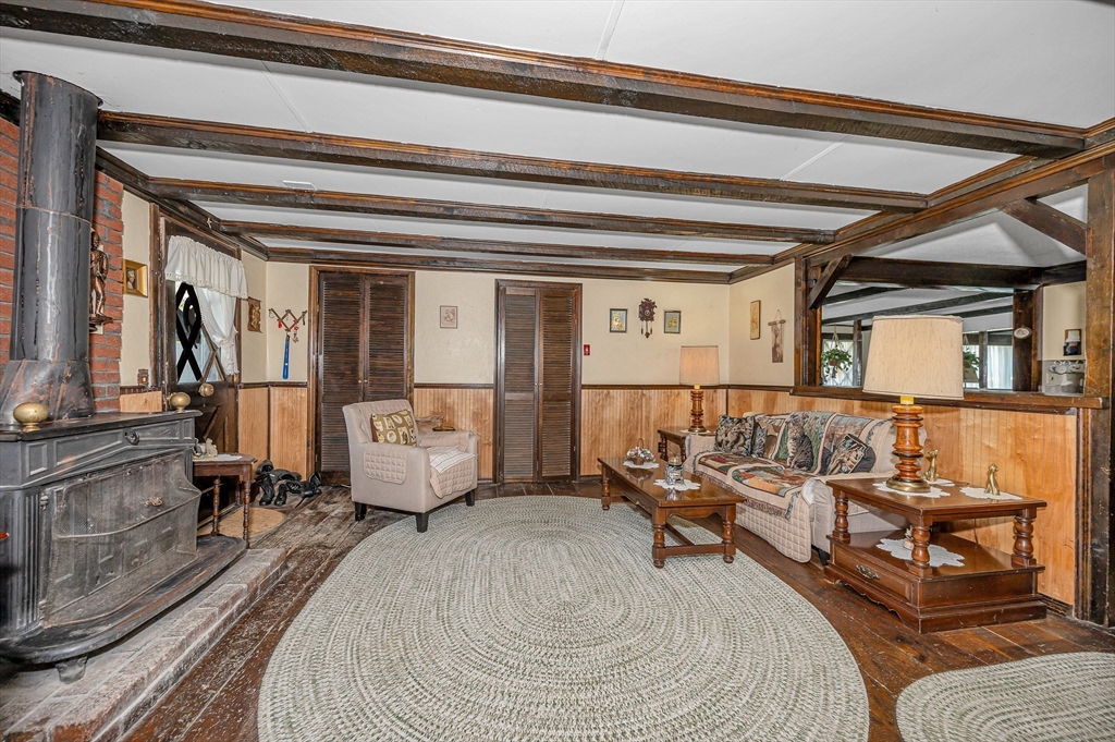 19 Reo Road Maynard, MA 01754 - Photo 26 of 41 a bedroom with furniture and a couch