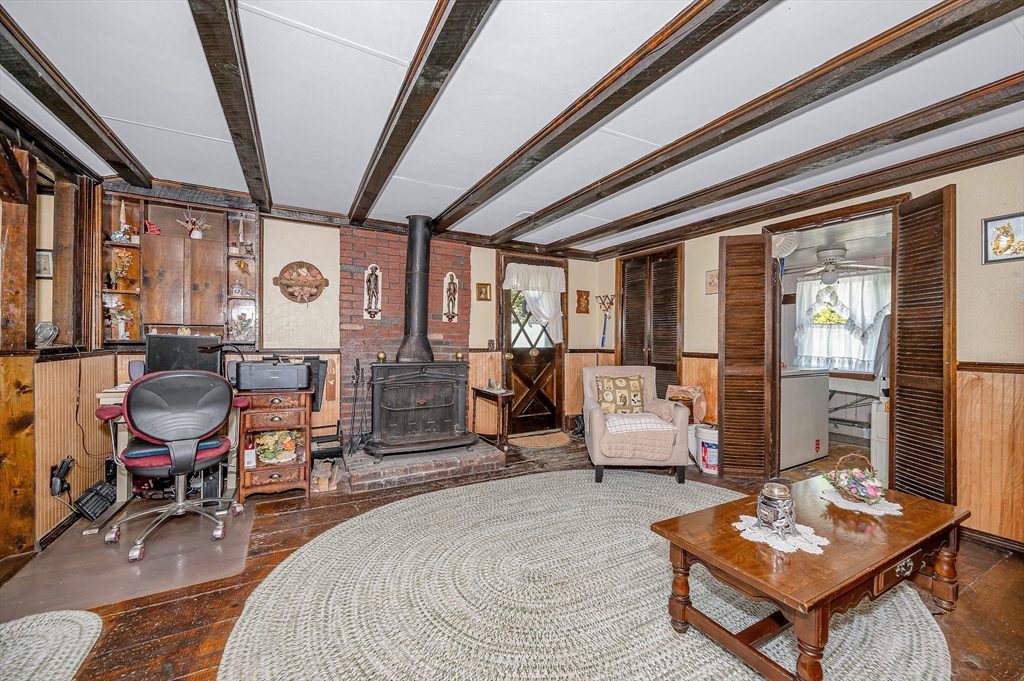 19 Reo Road Maynard, MA 01754 - Photo 28 of 41 a living room with furniture and a floor to ceiling window