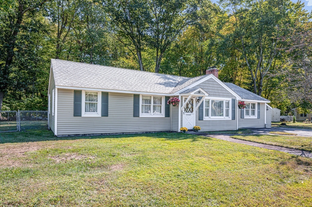 19 Reo Road Maynard, MA 01754 - Photo 30 of 41 a front view of a house with yard and green space