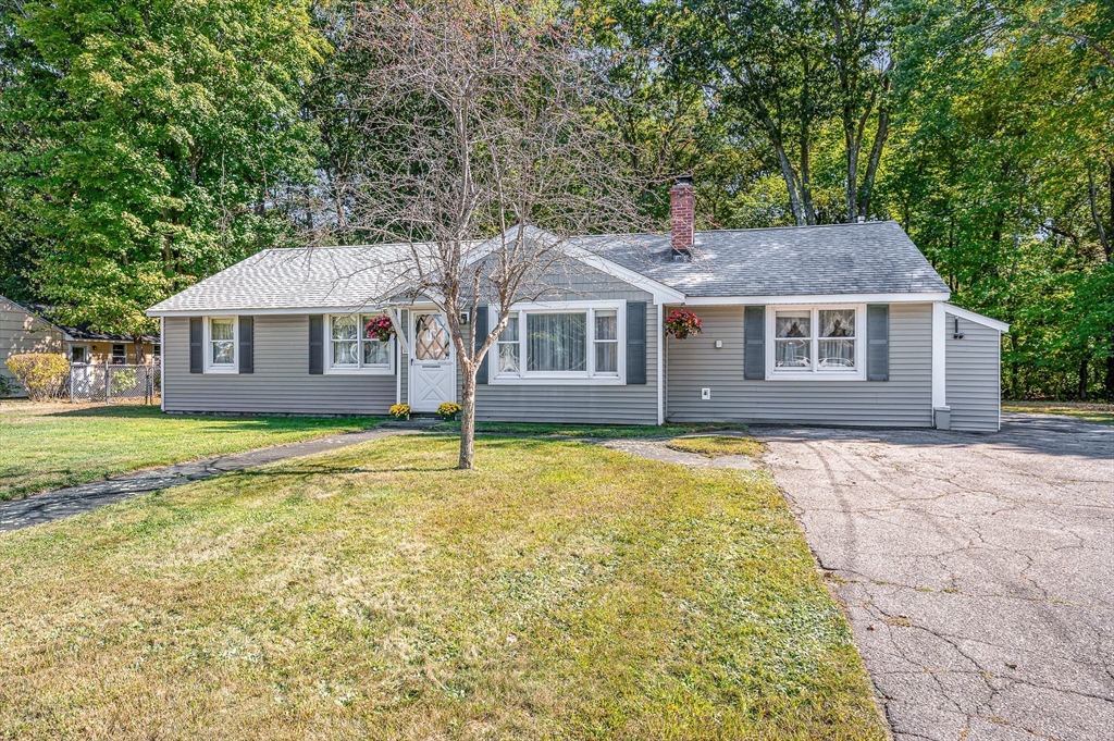 19 Reo Road Maynard, MA 01754 - Photo 31 of 41 a front view of a house with a garden