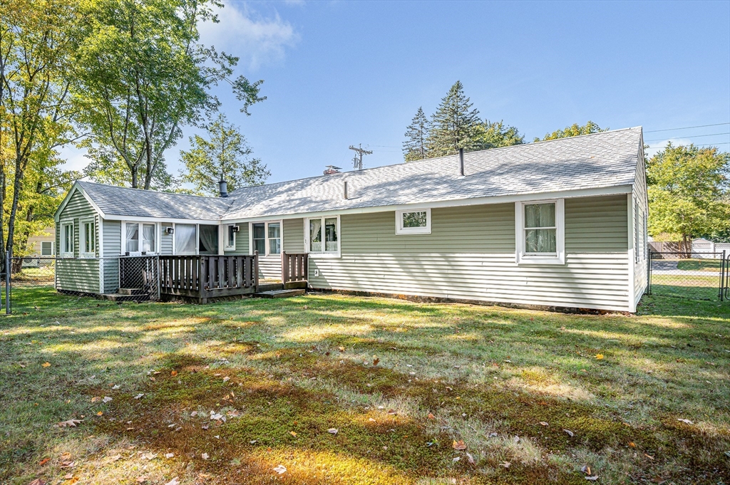 19 Reo Road Maynard, MA 01754 - Photo 33 of 41 a view of a house with a yard and sitting area