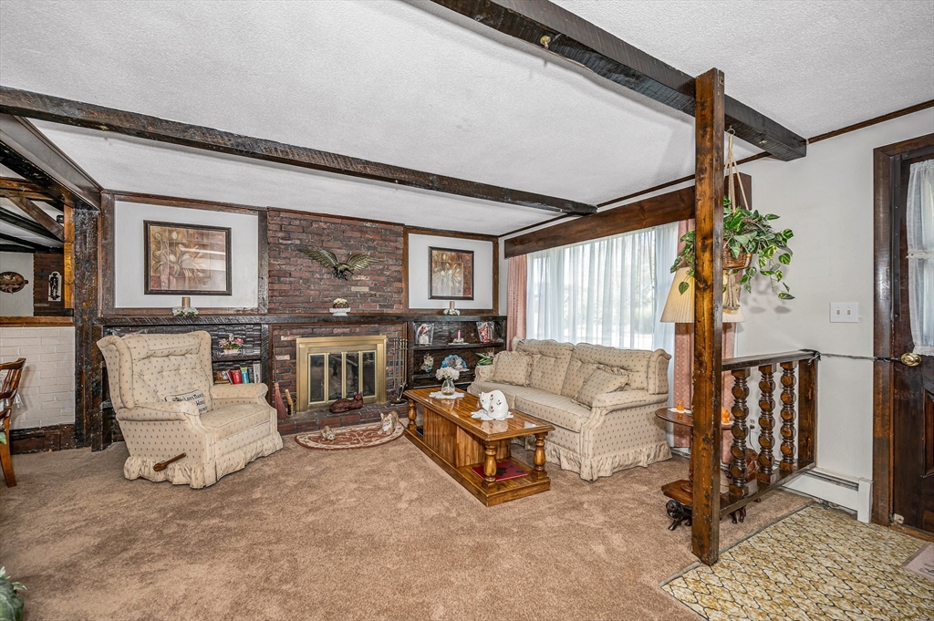 19 Reo Road Maynard, MA 01754 - Photo 4 of 41 a living room with furniture and a window