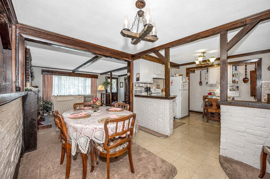 19 Reo Road Maynard, MA 01754 - Photo 9 of 41 a dining room with furniture and window