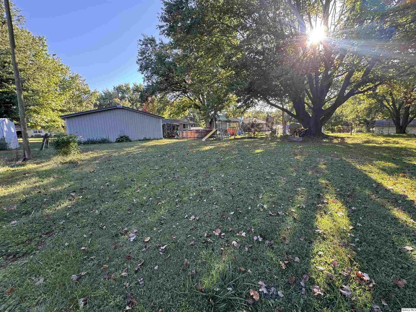 419 Willow Street Payson, IL 62360 - Photo 2 of 4 a view of a house with a yard
