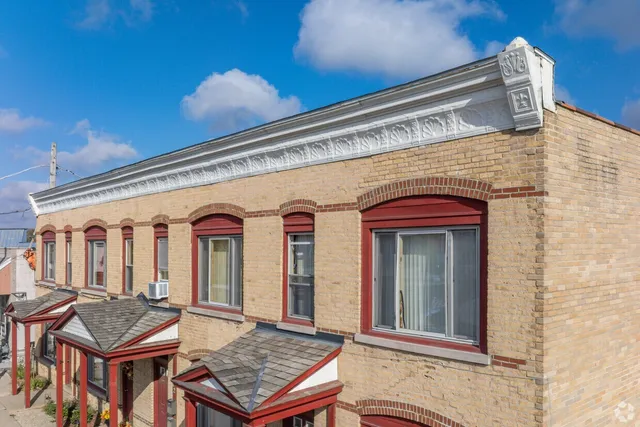 a front view of a building with glass windows