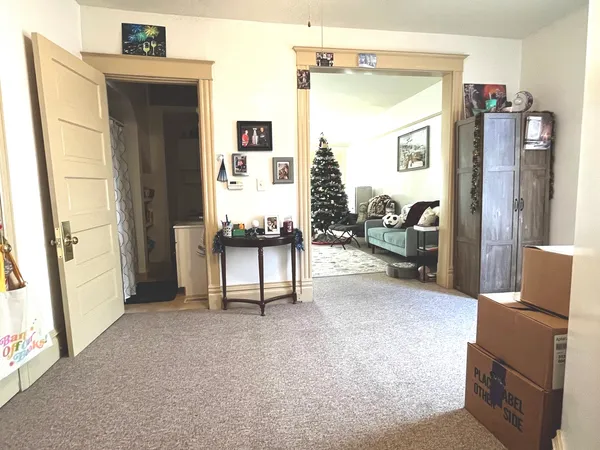 a view of livingroom with furniture and refrigerator