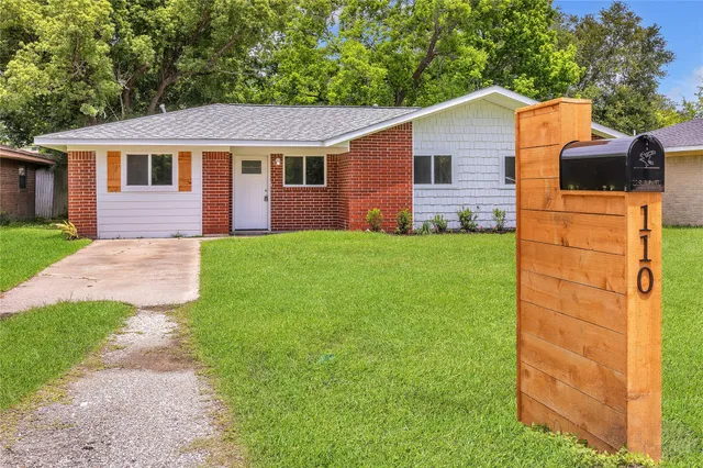a aerial view of a house with a yard