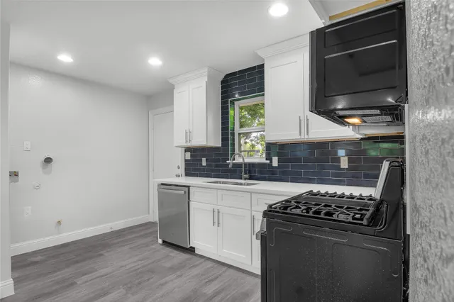 a kitchen with a stove and a microwave