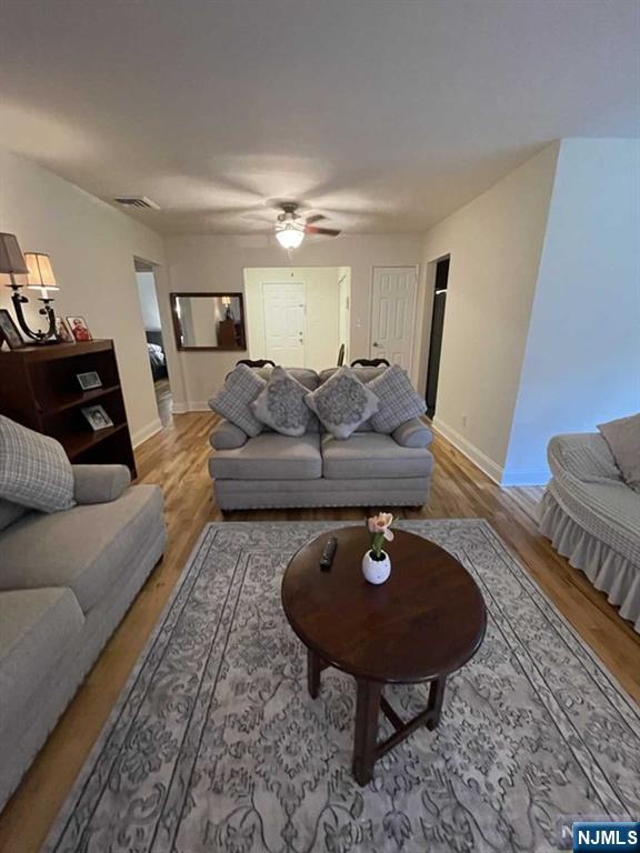 280-320 Oak Street, Unit 320C Ridgewood, NJ 07450 - Photo 14 of 25 a living room with furniture and a wooden floor