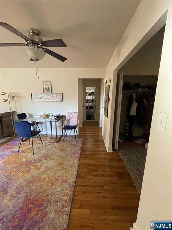 280-320 Oak Street, Unit 320C Ridgewood, NJ 07450 - Photo 3 of 25 a dining room with wooden floor and white walls