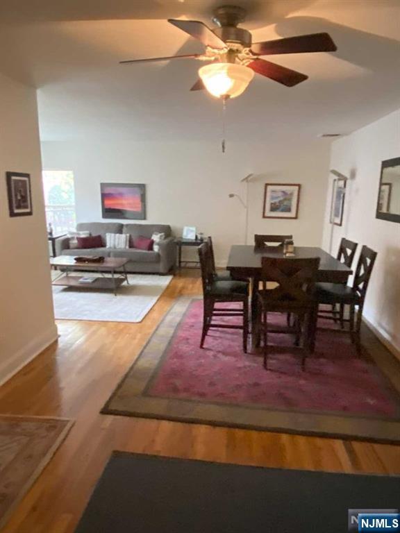280-320 Oak Street, Unit 320C Ridgewood, NJ 07450 - Photo 5 of 25 a living room with furniture a dining table and a piano