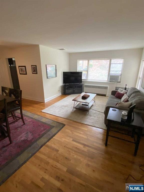 280-320 Oak Street, Unit 320C Ridgewood, NJ 07450 - Photo 6 of 25 a living room with furniture and a flat screen tv