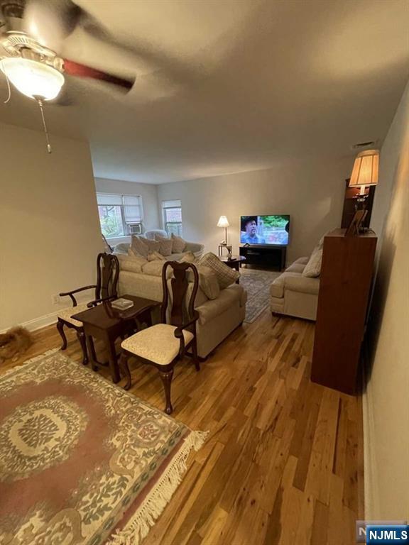 280-320 Oak Street, Unit 320C Ridgewood, NJ 07450 - Photo 8 of 25 a living room with furniture and a lamp