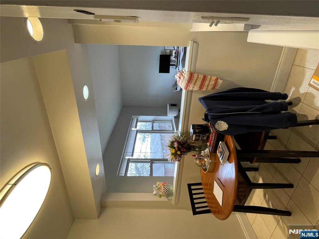 280-320 Oak Street, Unit 320C Ridgewood, NJ 07450 - Photo 9 of 25 a view of a dining room with furniture and window