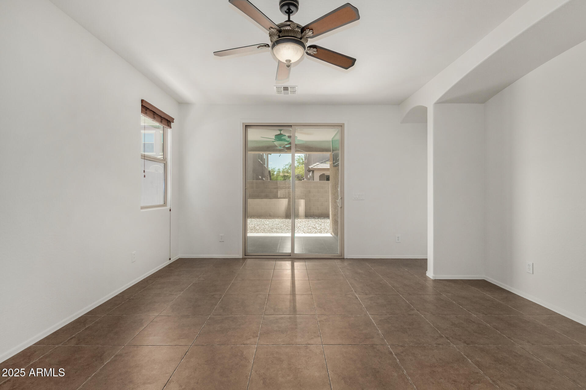 3313 West Gran Paradiso Drive Phoenix, AZ 85086 - Photo 12 of 31 a view of an empty room with a window