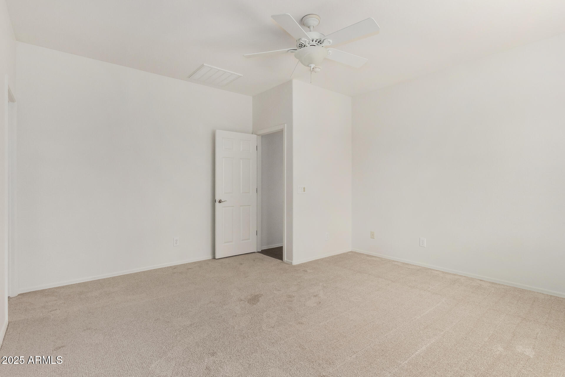 3313 West Gran Paradiso Drive Phoenix, AZ 85086 - Photo 15 of 31 an empty room with a ceiling fan and carpet