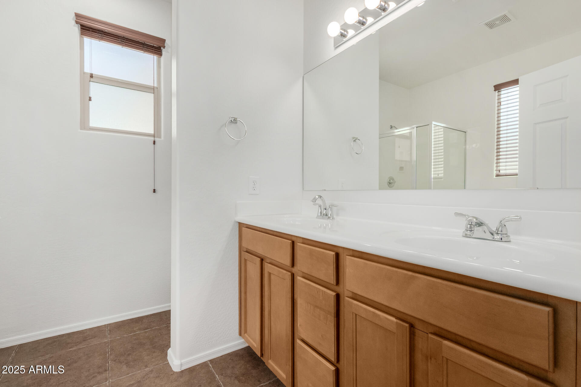 3313 West Gran Paradiso Drive Phoenix, AZ 85086 - Photo 17 of 31 a bathroom with a sink and a mirror