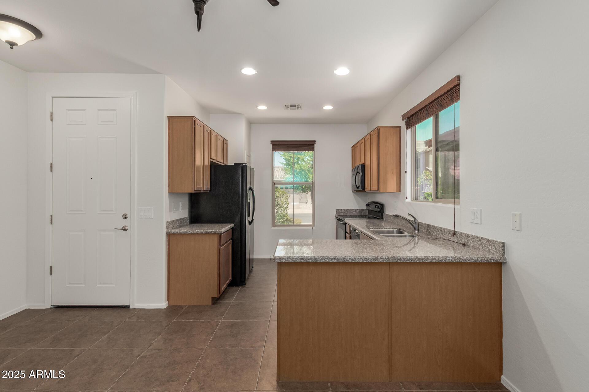 3313 West Gran Paradiso Drive Phoenix, AZ 85086 - Photo 6 of 31 a kitchen with a sink stove and refrigerator