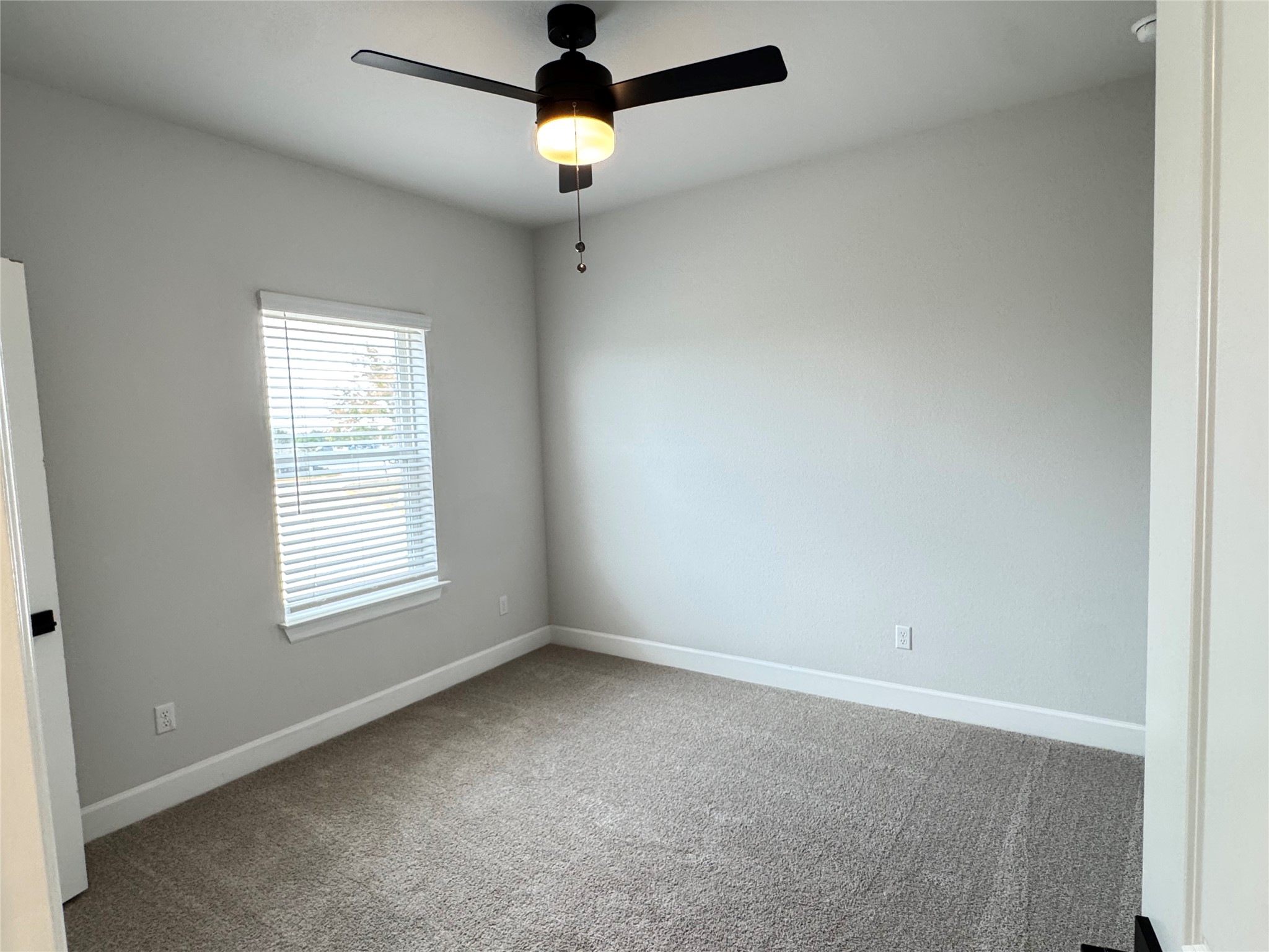3000 Chisholm Trail Road, Unit 63 Round Rock, TX 78681 - Photo 26 of 31 Unfurnished room with baseboards, a ceiling fan, and carpet