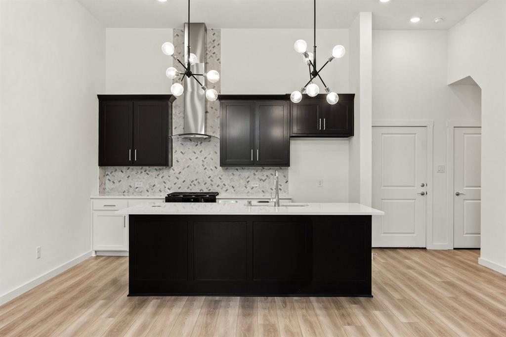 8513 Del Rio Trail Wylie, TX 75098 - Photo 11 of 33 a kitchen with stainless steel appliances a sink and a refrigerator