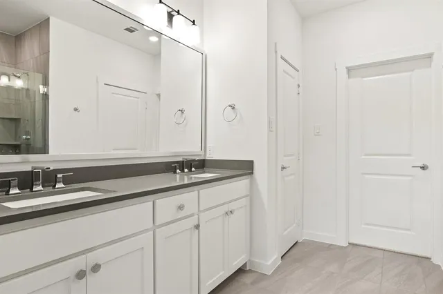 a bathroom with a sink a toilet and a bathtub