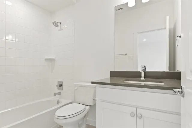 a view of storage and utility room with closet