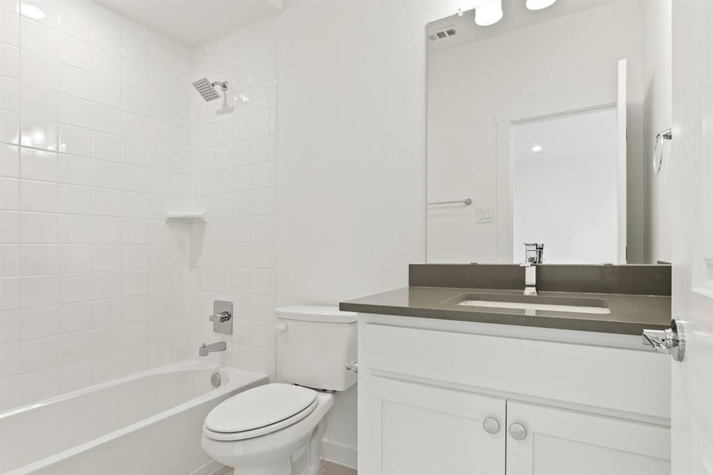 8513 Del Rio Trail Wylie, TX 75098 - Photo 30 of 33 a bathroom with a sink a toilet and shower