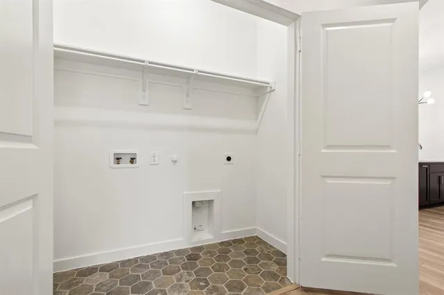 a front view of a house with a yard and a garage