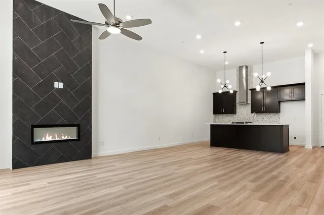 a kitchen with stainless steel appliances a sink and a refrigerator