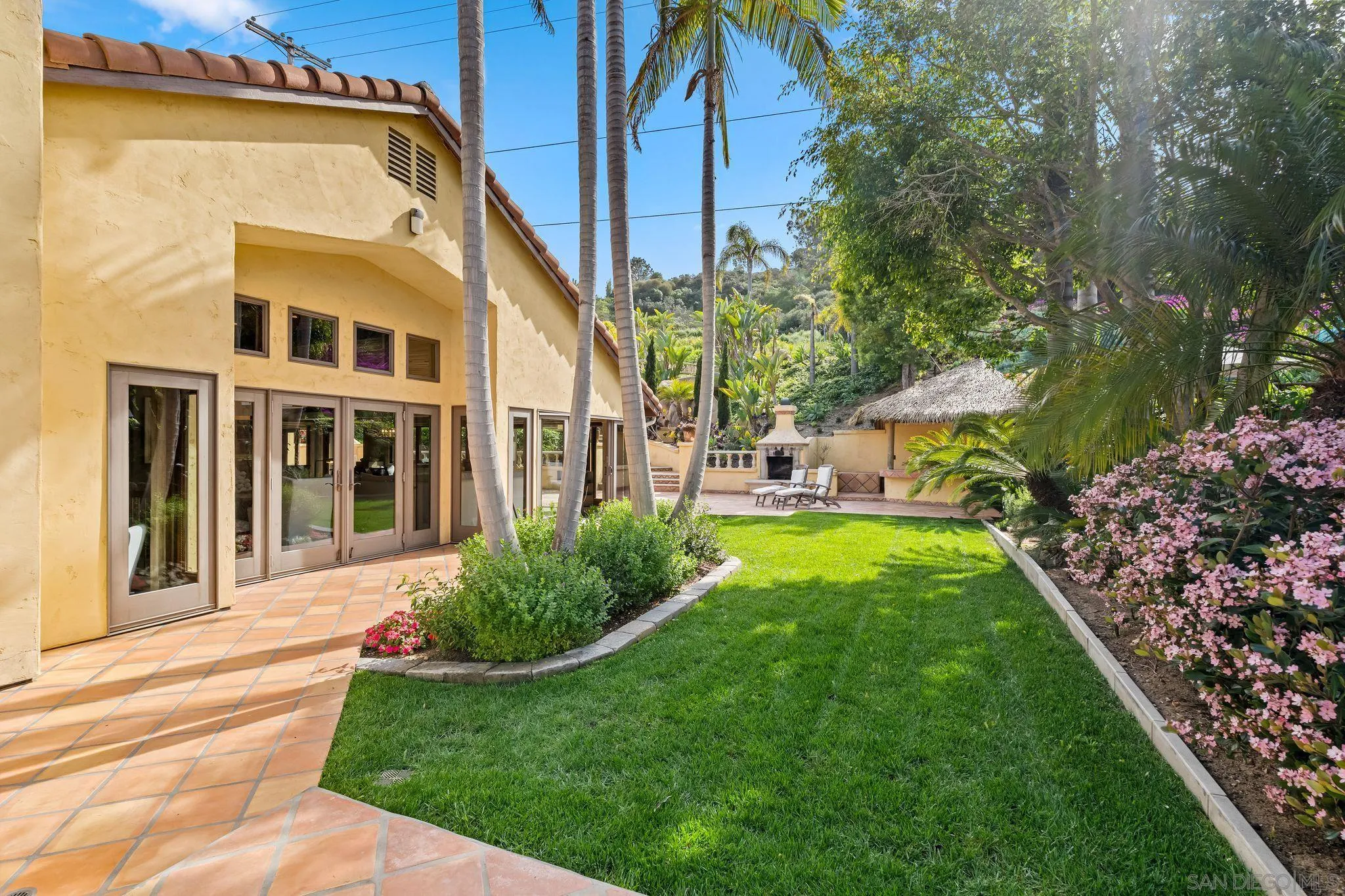 2969 Racetrack View Drive Del Mar, CA 92014 - Photo 38 of 59 a view of an house with backyard space and garden
