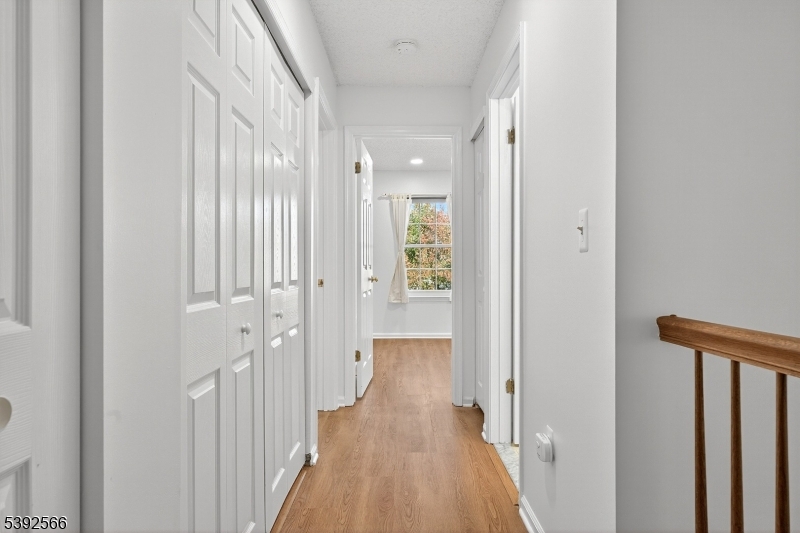 3509 French Drive, Unit 9 Bridgewater, NJ 08807 - Photo 12 of 22 a view of a hallway with a wooden floor