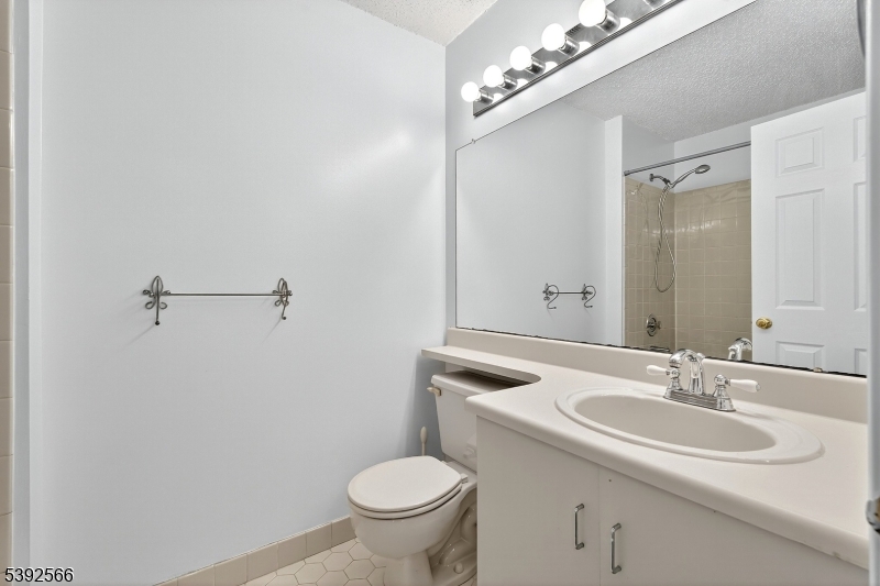 3509 French Drive, Unit 9 Bridgewater, NJ 08807 - Photo 19 of 22 a bathroom with a sink toilet and a mirror