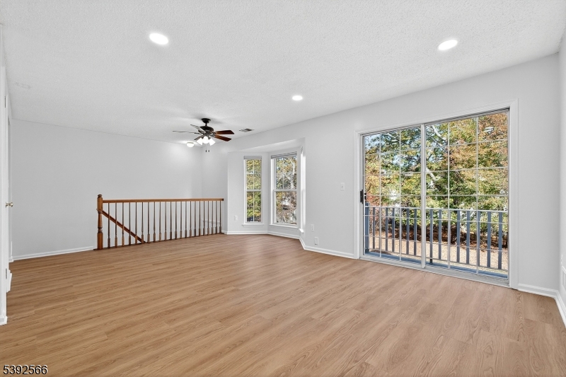 3509 French Drive, Unit 9 Bridgewater, NJ 08807 - Photo 6 of 22 a view of a livingroom with a ceiling fan and window