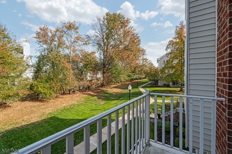 3509 French Drive, Unit 9 Bridgewater, NJ 08807 - Photo 8 of 22 a balcony with trees in front of it