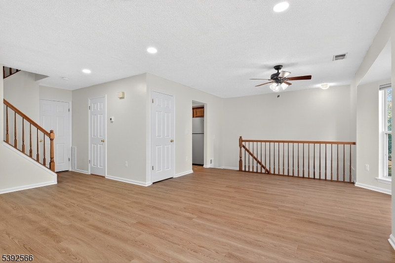 3509 French Drive, Unit 9 Bridgewater, NJ 08807 - Photo 9 of 22 a view of an empty room with wooden floor