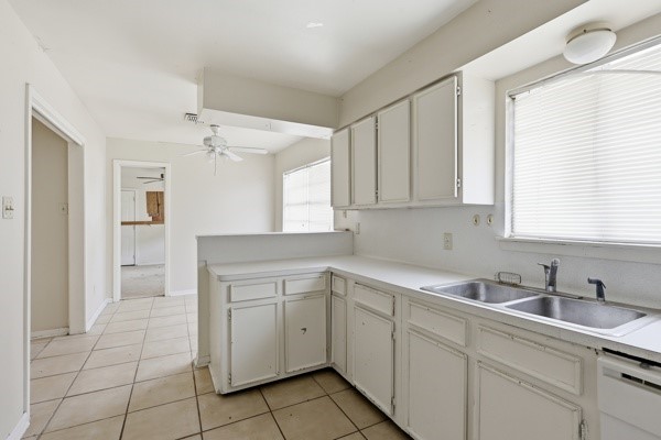 1655 Hawthorne Street Houston, TX 77006 - Photo 23 of 39 a kitchen with white cabinets appliances and a sink