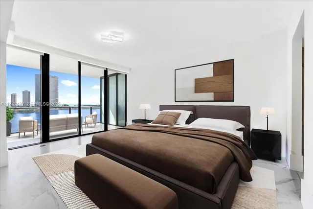 a bedroom with a large bed and a couch