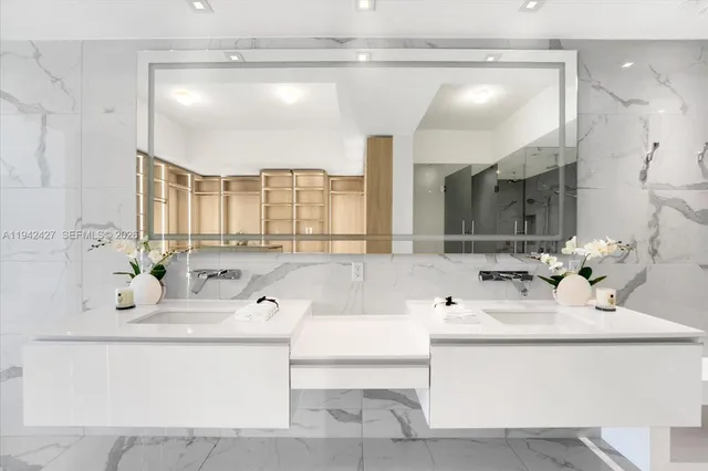 a bathroom with a sink vanity and mirror