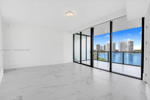 a view of an empty room with a window