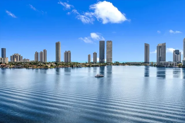 a view of a ocean with tall building