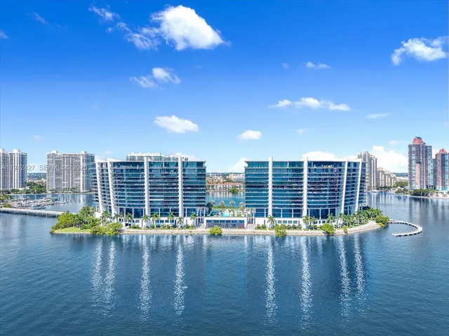 a view of a ocean with tall building