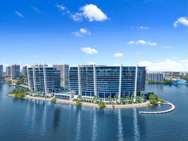 a view of a swimming pool with outdoor seating and plants