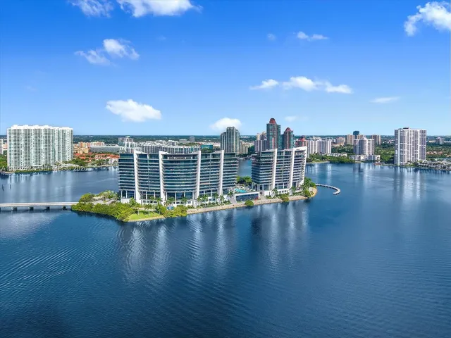 a view of a swimming pool with outdoor seating and plants