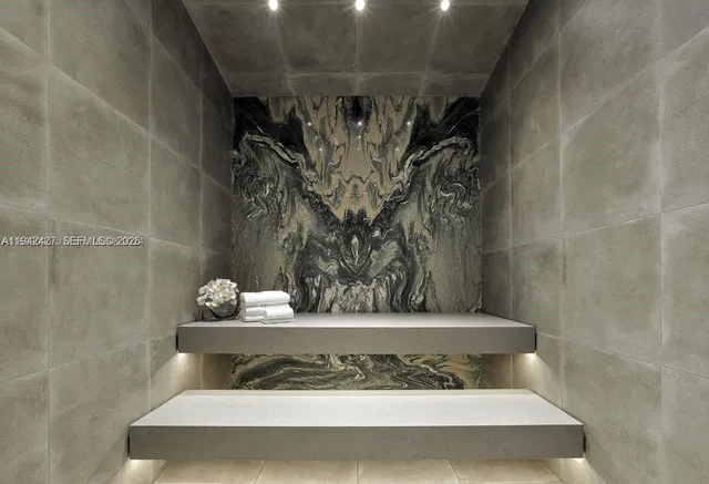 a living room with furniture a floor to ceiling window and a flat screen tv