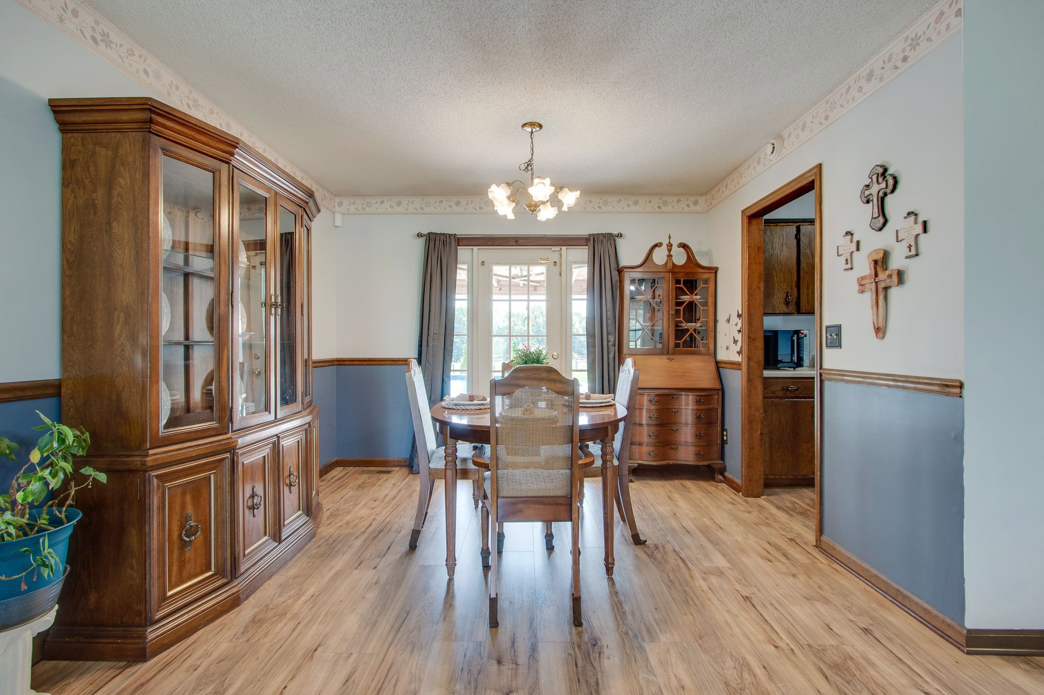 207 Eaton Heights Manchester, TN 37355 - Photo 11 of 37 a view of a dining room with furniture window and wooden floor
