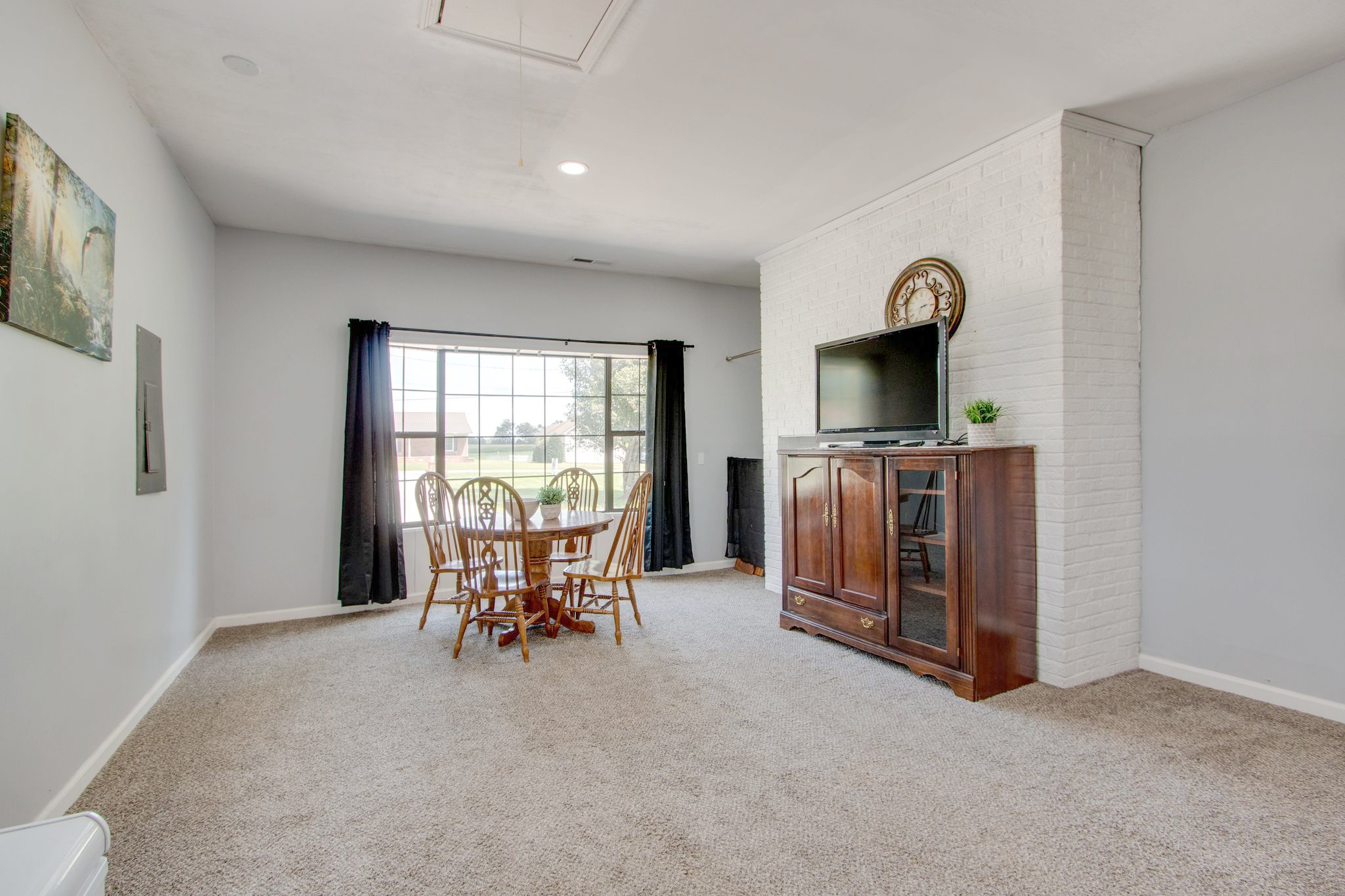 207 Eaton Heights Manchester, TN 37355 - Photo 18 of 37 a view of a livingroom with furniture hardwood floor and a window