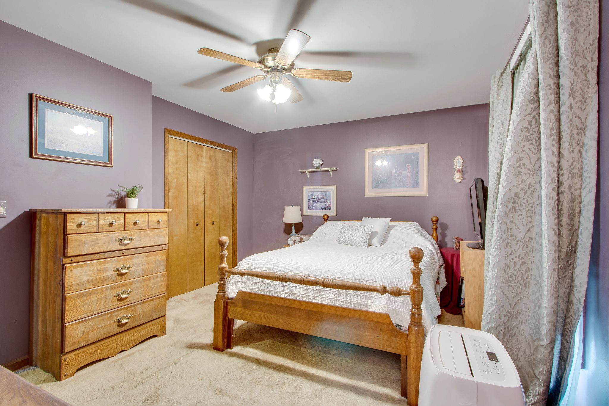 207 Eaton Heights Manchester, TN 37355 - Photo 19 of 37 a bed room with a bed and a chandelier