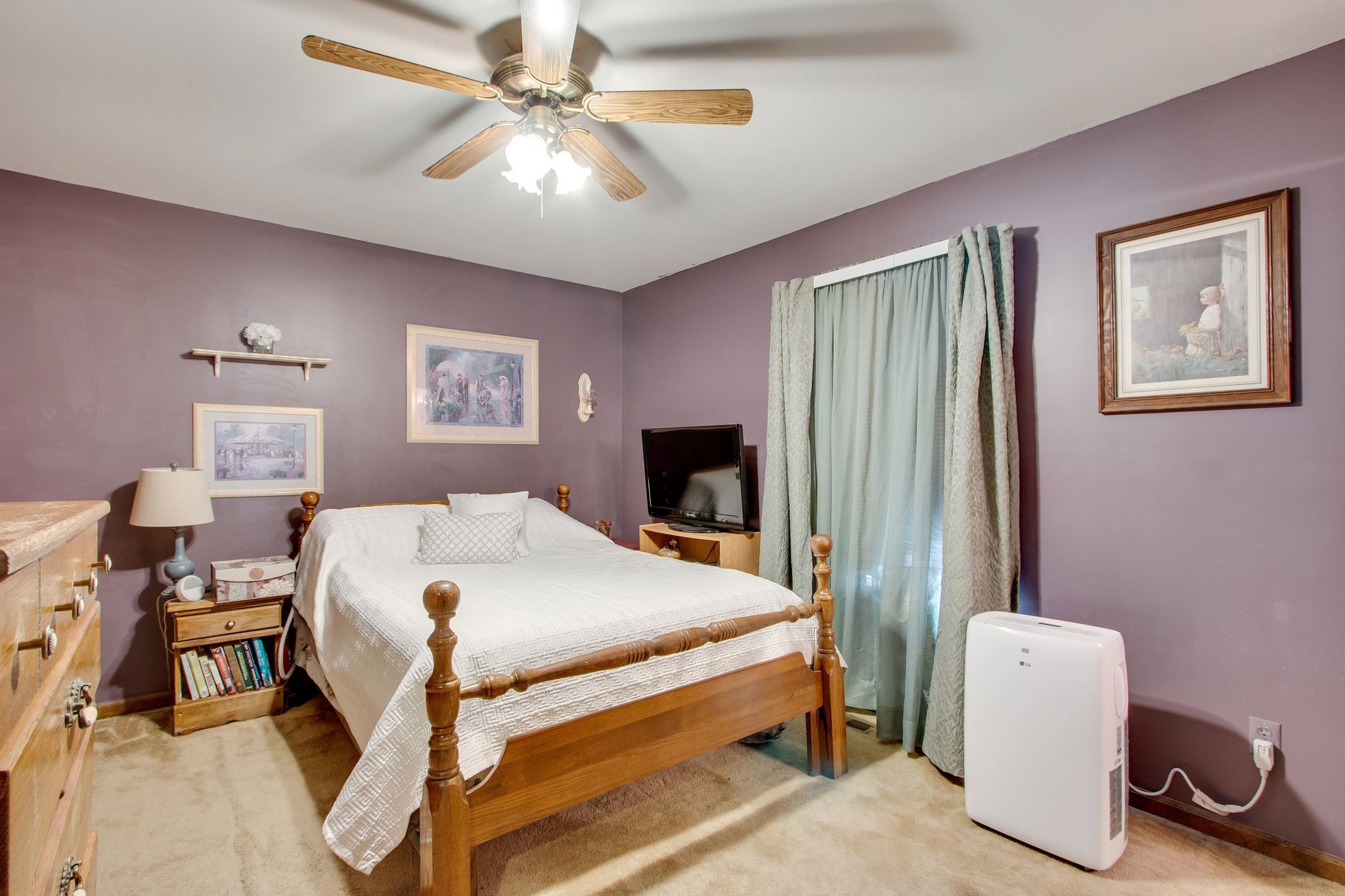 207 Eaton Heights Manchester, TN 37355 - Photo 20 of 37 a bedroom with a bed and a chandelier