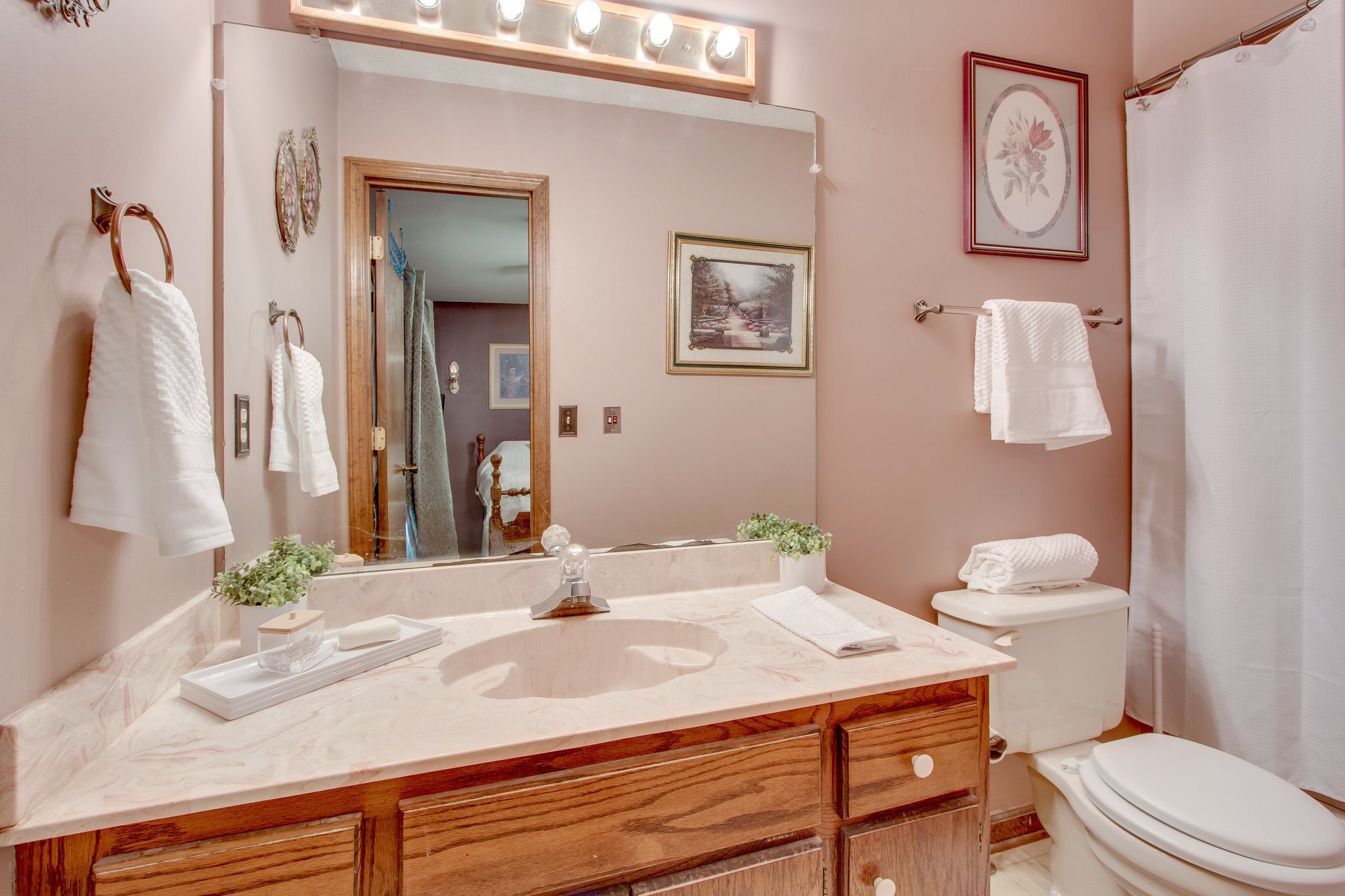 207 Eaton Heights Manchester, TN 37355 - Photo 22 of 37 a bathroom with a sink vanity mirror and toilet